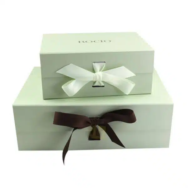 display two custom green rigid boxes with ribbon closure in different sizes