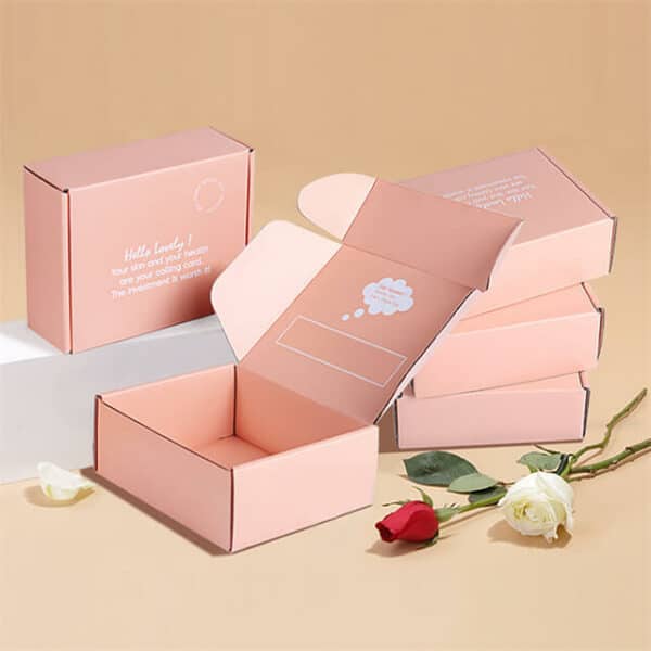 display a bunch of custom tuck-top mailer carton boxes and there are two roses beside