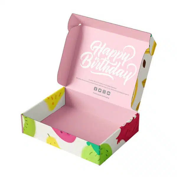 muestra una caja impresa personalizada con interior rosa y exterior colorido en estado abierto