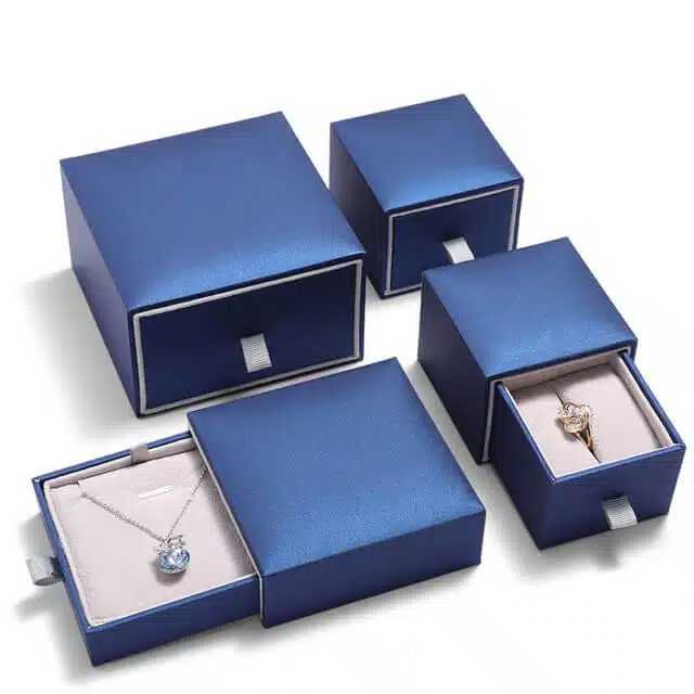 display four custom navy blue jewelry boxes in drawer style