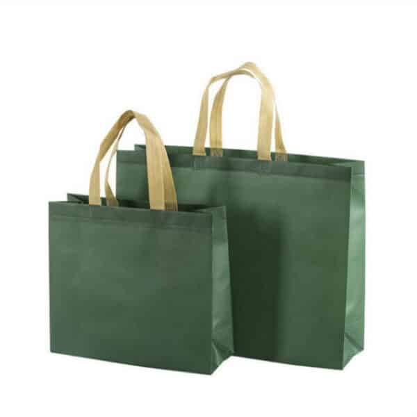 display two green custom large commerce non woven tote bags in different sizes