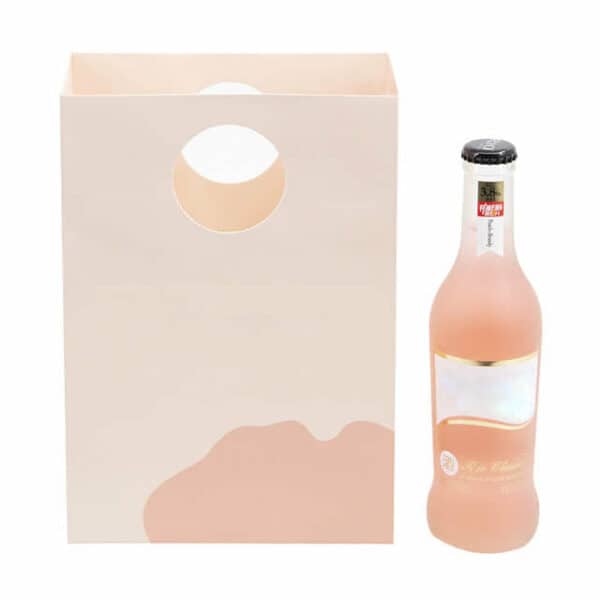 display the front of the custom paper bag with round die-cut handles and a bottle of drink besides