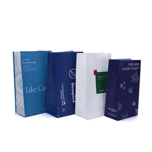 prikazati četiri prilagođene SOS papirnate vrećice za putovanja avionom u različitim izgledima