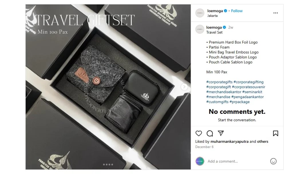 A sleek travel gift set featuring a felt pouch, adapter pouch, and cable pouch, presented in a premium black box with embossed logo branding