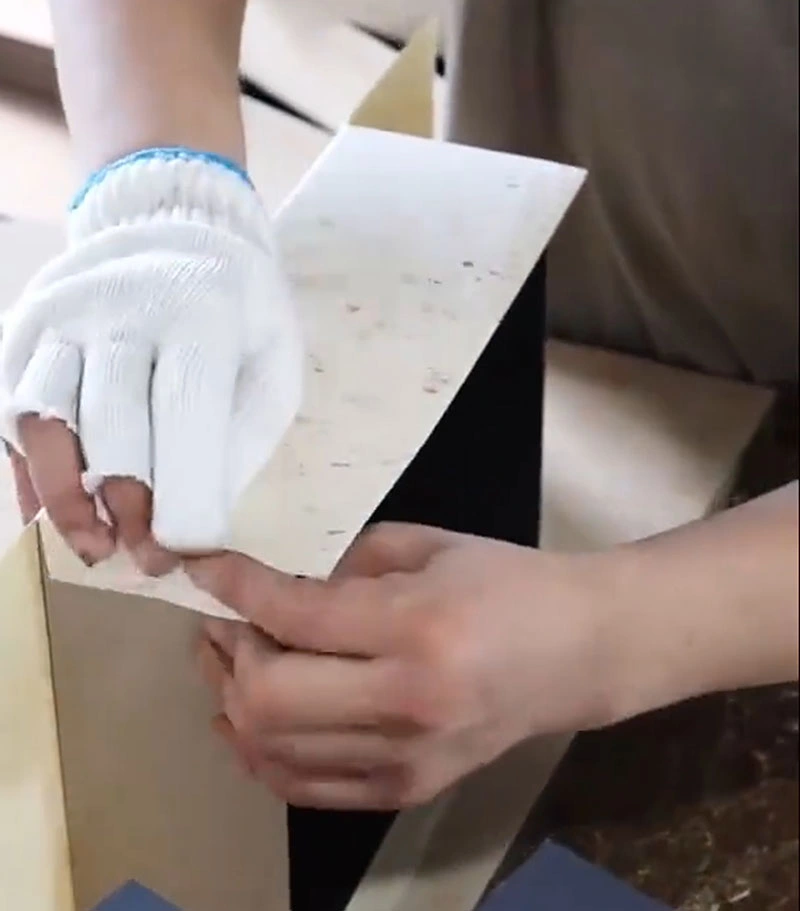The Basic Guide of What is a Rigid Box? 5 display a pair of hands wrapping the box