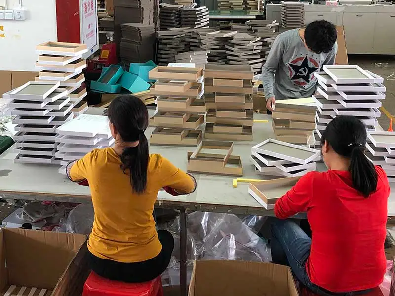 The Basic Guide of What is a Rigid Box? 6 three people are check the quality of the box