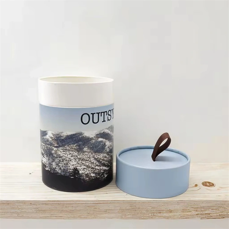 there is a cardboard tube with the lid. and there is a ribbon tab in the lid