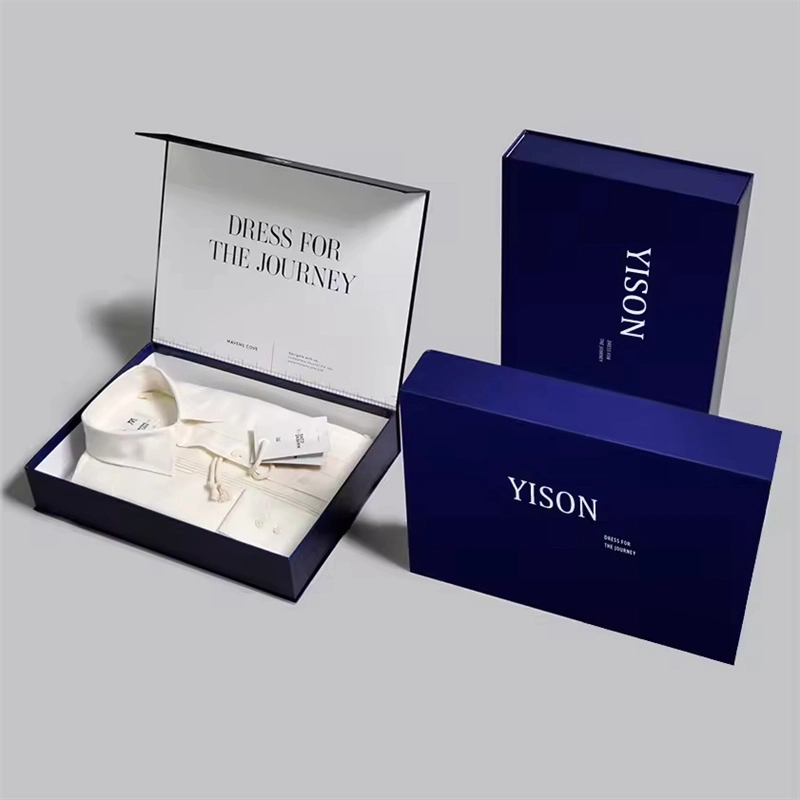 there are three dark blue magnetic closure boxes, ont of them is open and there is one shirt inside
