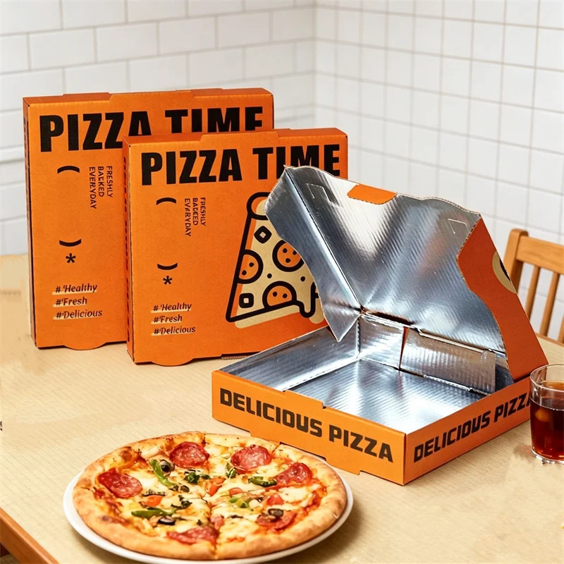 there are three pizza boxes with aluminum-coated insulated liner and a pizza on a plate